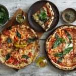 Two pizzas on display